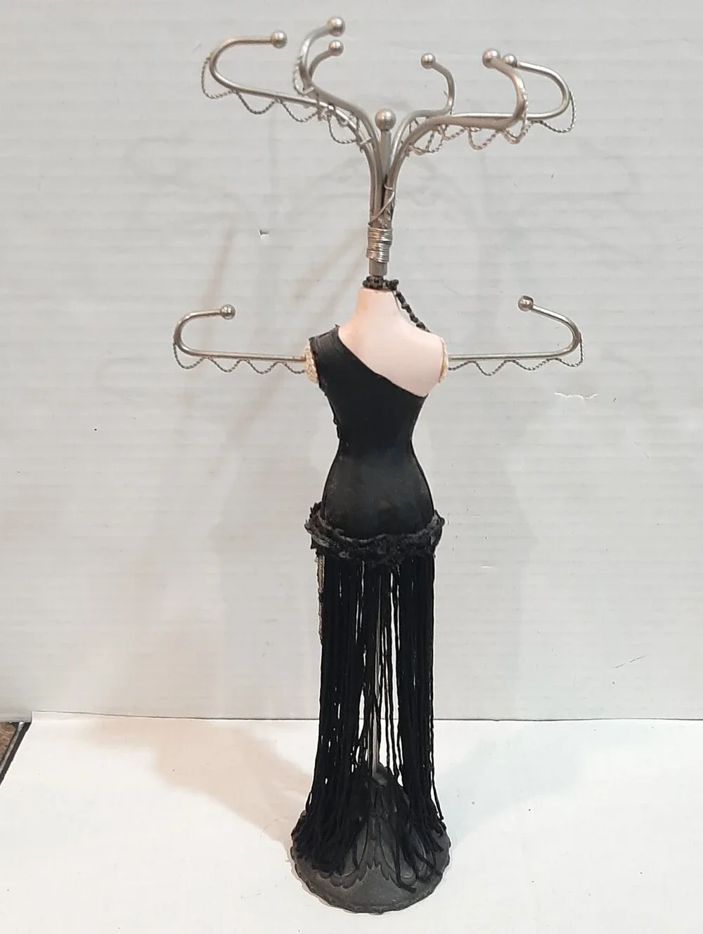 Black fringed flapper dress jewelry display stand